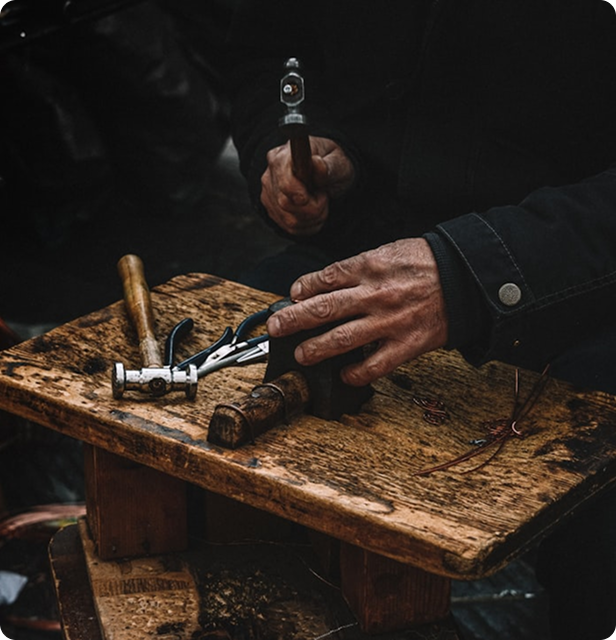 Artisan working with tools on a workbench